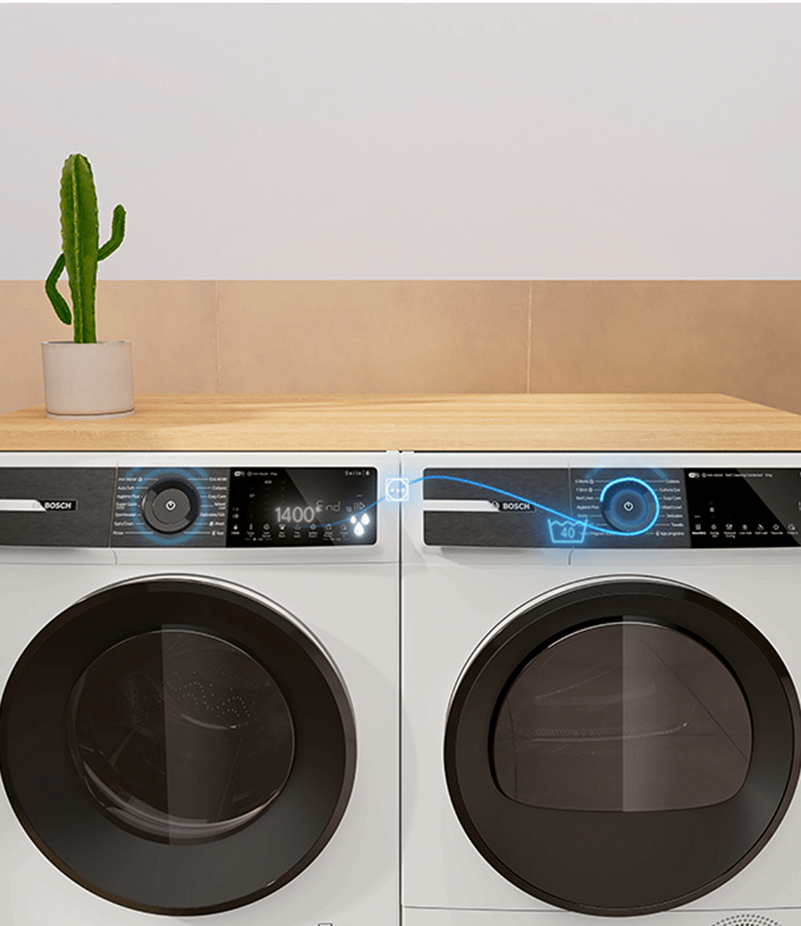 Pralka i suszarka Bosch obok siebie. Łączą się za pomocą aplikacji