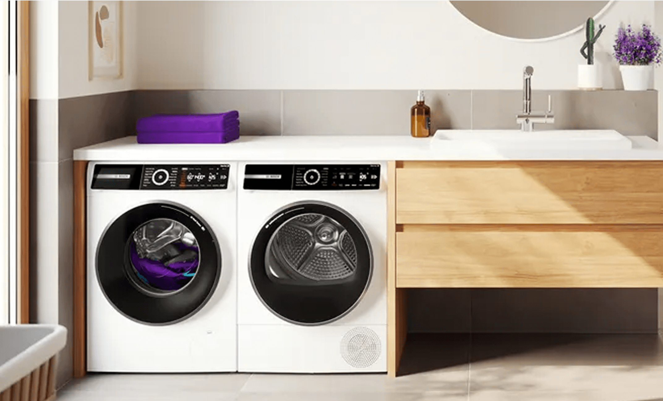 Pralka i suszarka Bosch stoją w nowoczesnej łazience